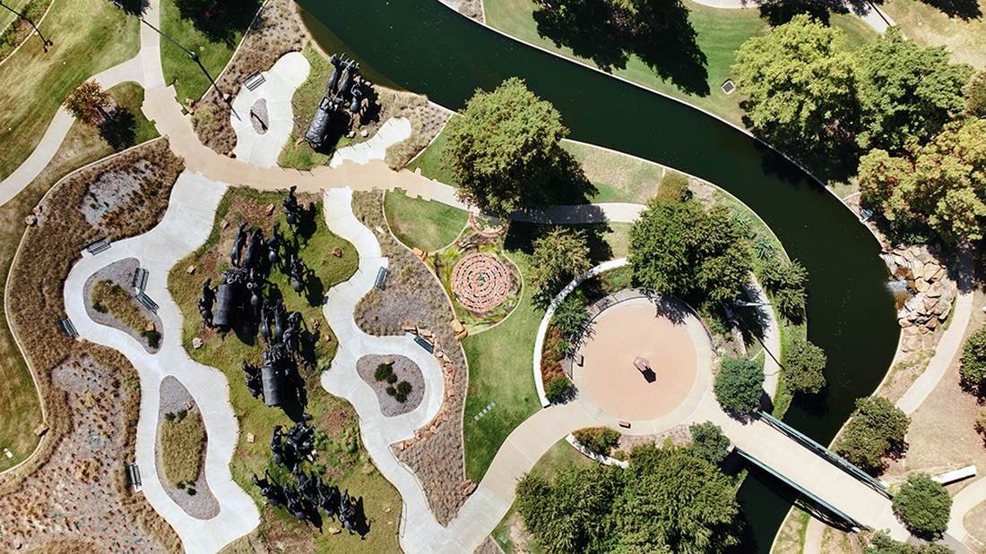 Aerial photograph of the Bricktown site showing the Land Run Monument statues, the spiral installation location, and the canal